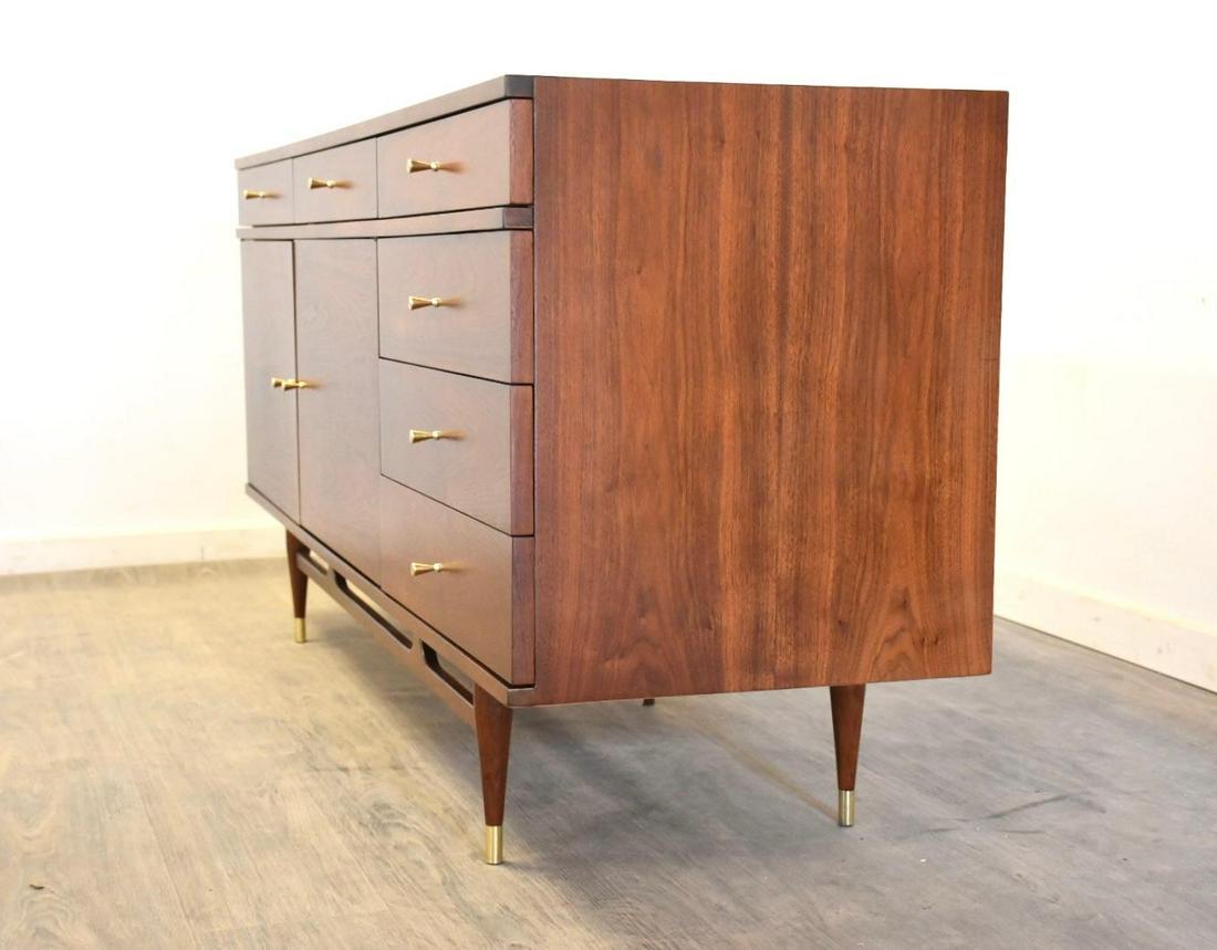 Walnut & Brass Long Dresser: Walnut & Brass Long Dresser A mid century modern long walnut dresser with brass ferrules and drawer pulls in the style of Paul McCobb. Professionally refinished. 72" wide. 21" deep. 33.25" tall. Dimen