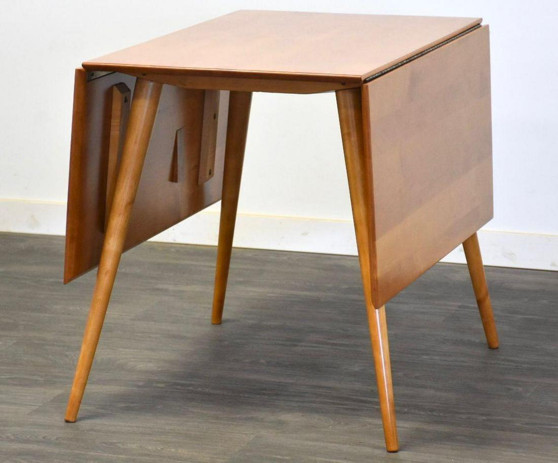 Paul McCobb Planner Group Dining Table: Paul McCobb Planner Group Dining Table A mid century modern maple dining table designed by Paul McCobb Planner Group. The top surface area is 22.125" with the leaves folded down. Fully extended it mea