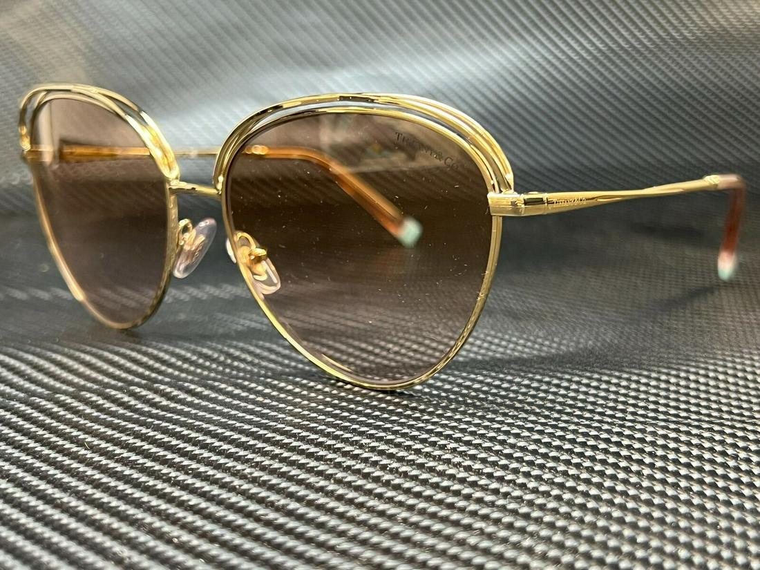 TIFFANY TF3075 61562D Pale Gold Round Women's 58 mm Sunglasses: TIFFANY TF3075 61562D Pale Gold Round Women's 58 mm Sunglasses Type: Sunglasses Frame Color: Gold Style: Round New The BIDHAUS Guarantee: All items in this auction are guaranteed to be 100% authentic.