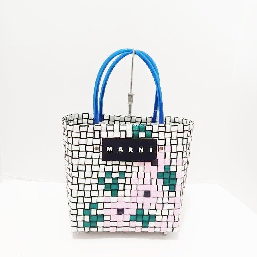 MARNI - Blue White Multi Vinyl Tote Bag: MARNI - Blue White Multi Vinyl Tote Bag Style: Tote Bag Exterior Color: Blue White Multi Exterior Material: Vinyl Accessories: None Type: Tote Bag C: Heavily Used The BIDHAUS Guarantee: All items in t