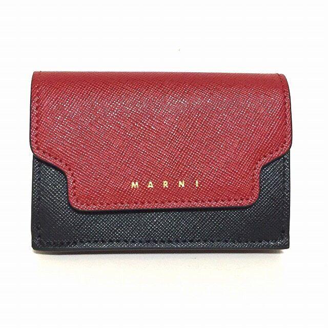 MARNI - Red Black Pink Leather Trifold Wallet: MARNI - Red Black Pink Leather Trifold Wallet Style: Trifold Wallet Color: Red Black Pink Material: Leather Accessories: Box Dust Bag Cover Type: Trifold Wallet AB: Very Good The BIDHAUS Guarantee: Al
