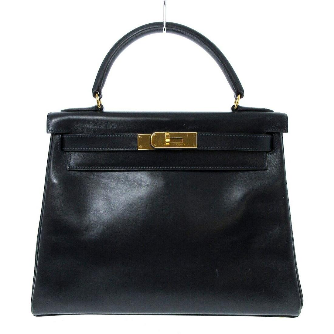 HERMES Kelly 28 - Dark Navy Box Calf Circle W Handbag: HERMES Kelly 28 - Dark Navy Box Calf Circle W Handbag Style: Handbag Exterior Color: Dark Navy Exterior Material: Box Calf Product Name: Kelly 28 Date Code/Stamp: Circle W Accessories: Box Dust Bag Ty