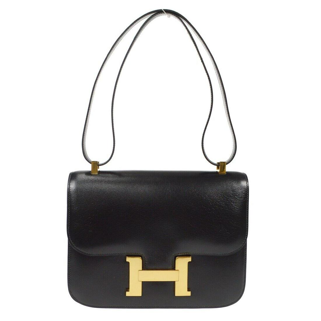 HERMES CONSTANCE 23 Shoulder Bag Black Box calf OS 1X: HERMES CONSTANCE 23 Shoulder Bag Black Box calf OS 1X Bag Width: 9 in Bag Height: 7 in Handle Style: Shoulder Strap Bag Depth: 2 in Exterior Material: Box calf Exterior Color: Black Style: Shoulder Ba