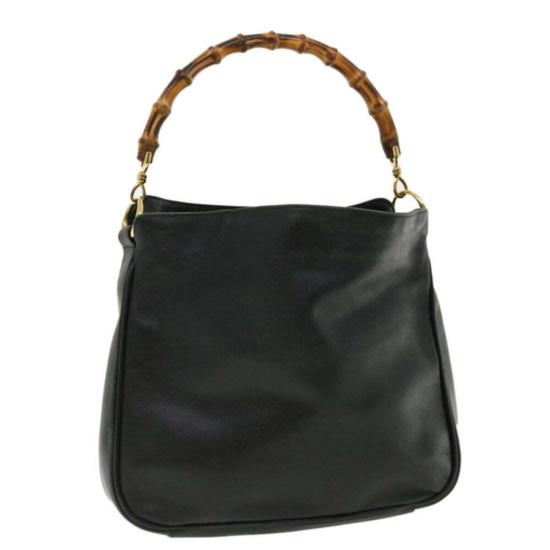 GUCCI Bamboo Hand Bag Leather Black: GUCCI Bamboo Hand Bag Leather Black Style: Hand Bag Material: Leather Exterior Color: Black Bag Height: 9.4inch(Approx) / 24cm(Approx) Bag Depth: 3.5inch(Approx) / 9cm(Approx) Bag Length: 11.8inch(App