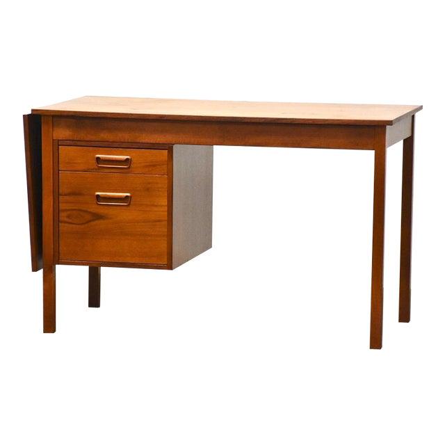 Danish Modern Teak Drop Leaf Desk: Danish Modern Teak Drop Leaf Desk A mid century modern teak desk in the style of Arne Vodder with a single drop leaf which when extended extends the desk to 65". One drawer capable of holding files. F