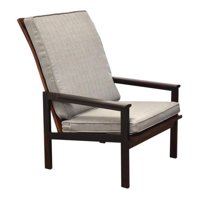 Illum Wikkelso Rosewood High Back Lounge Chair: Illum Wikkelso Rosewood High Back Lounge Chair A rare mid century modern rosewood high back lounge chair designed by Illum Wikkelso for Niels Eilersen is Denmark with grey upholstered cushions. Seat h