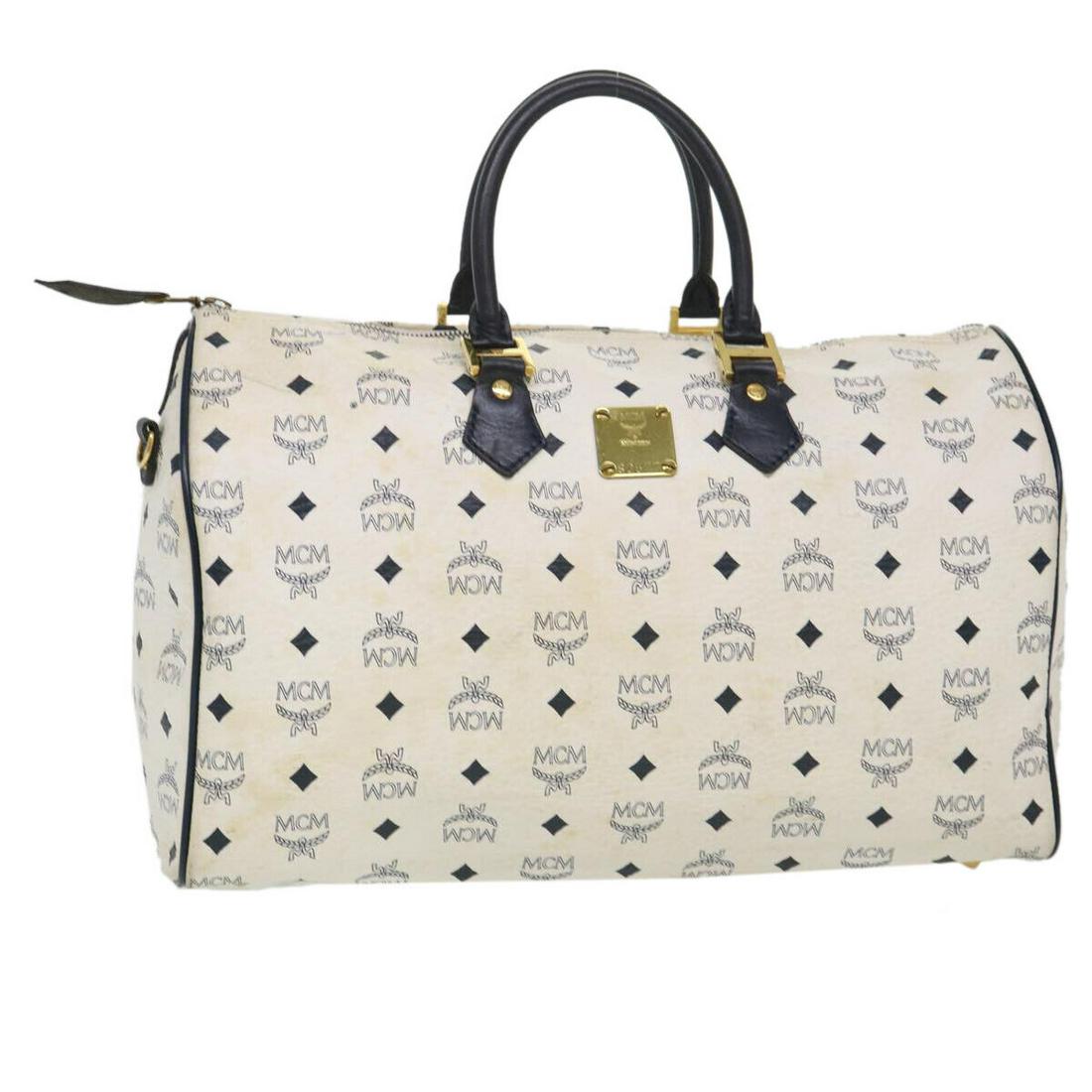 MCM Vicetos Hand Bag PVC Leather White Black: MCM Vicetos Hand Bag PVC Leather White Black Style: Hand Bag Material: PVC Leather Exterior Color: White / Black Bag Height: 9.8inch(Approx) / 25cm(Approx) Bag Depth: 7.9inch(Approx) / 20cm(Approx) Ba