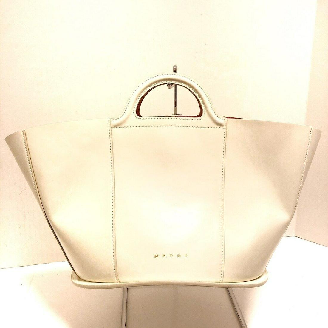 MARNI White Leather Handbag: MARNI White Leather Handbag Style: Handbag Exterior Color: White Exterior Material: Leather Accessories: Dust Bag Pouch (detachable) Type: Handbag C: Heavily Used The BIDHAUS Guarantee: All items in t