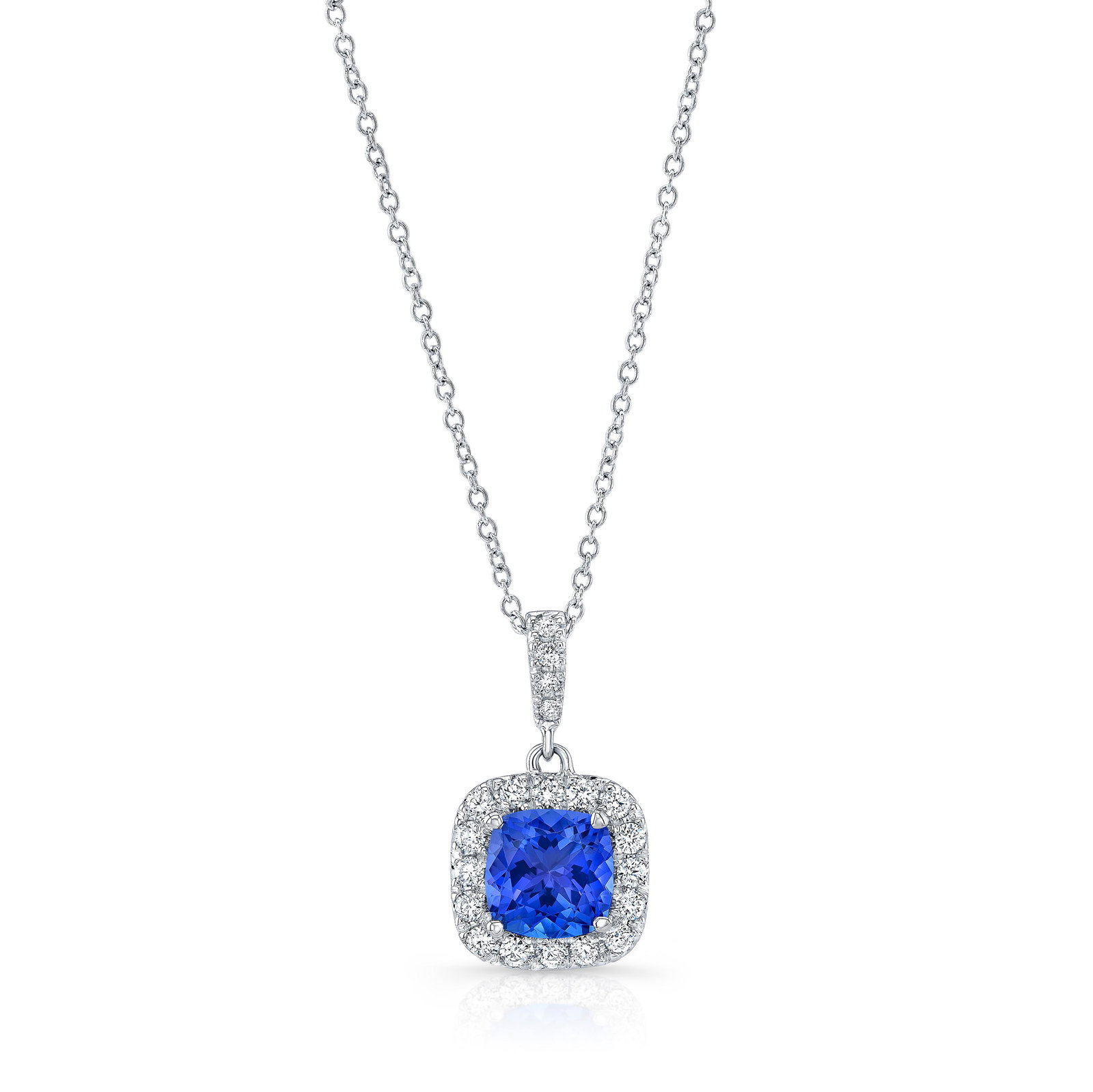 Tanzanite Cushion Cut Halo Pendant In 18k White Gold: Tanzanite Cushion Cut Halo Pendant In 18k White Gold 18k White Gold Halo Pendant With 20 Round Brilliant Diamonds Weighing 0.25 Carats On A 16-inch Cable Chain And A Tanzanite Cushion Cut Center Measu
