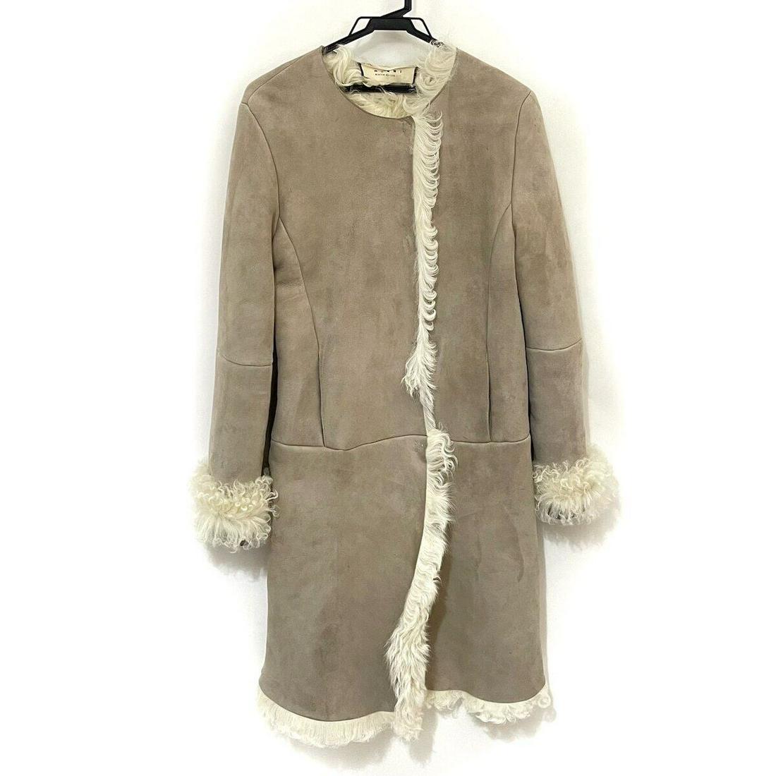 MARNI - Beige Womens Coat: MARNI - Beige Womens Coat Style: Coat Color: Beige Outer Shell Material: Please see the photo of the quality tag Accessories: None Type: Coat Size: 42 C: Heavily Used The BIDHAUS Guarantee: All items