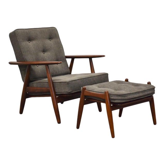 Hans Wegner Danish "Cigar" Lounge Chair & Ottoman: Hans Wegner Danish "Cigar" Lounge Chair & Ottoman A solid beech walnut color lounge chair and ottoman with grey cushions designed by Hans Wegner for GETAMA. Professionally refinished. Seat height is 1