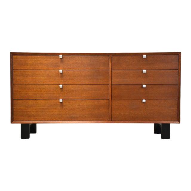 George Nelson Herman Miller Dresser: George Nelson Herman Miller Dresser A mid century modern walnut dresser credenza with aluminum finger pulls designed by George Nelson for Herman Miller. Black lacquered legs. Professionally refinished