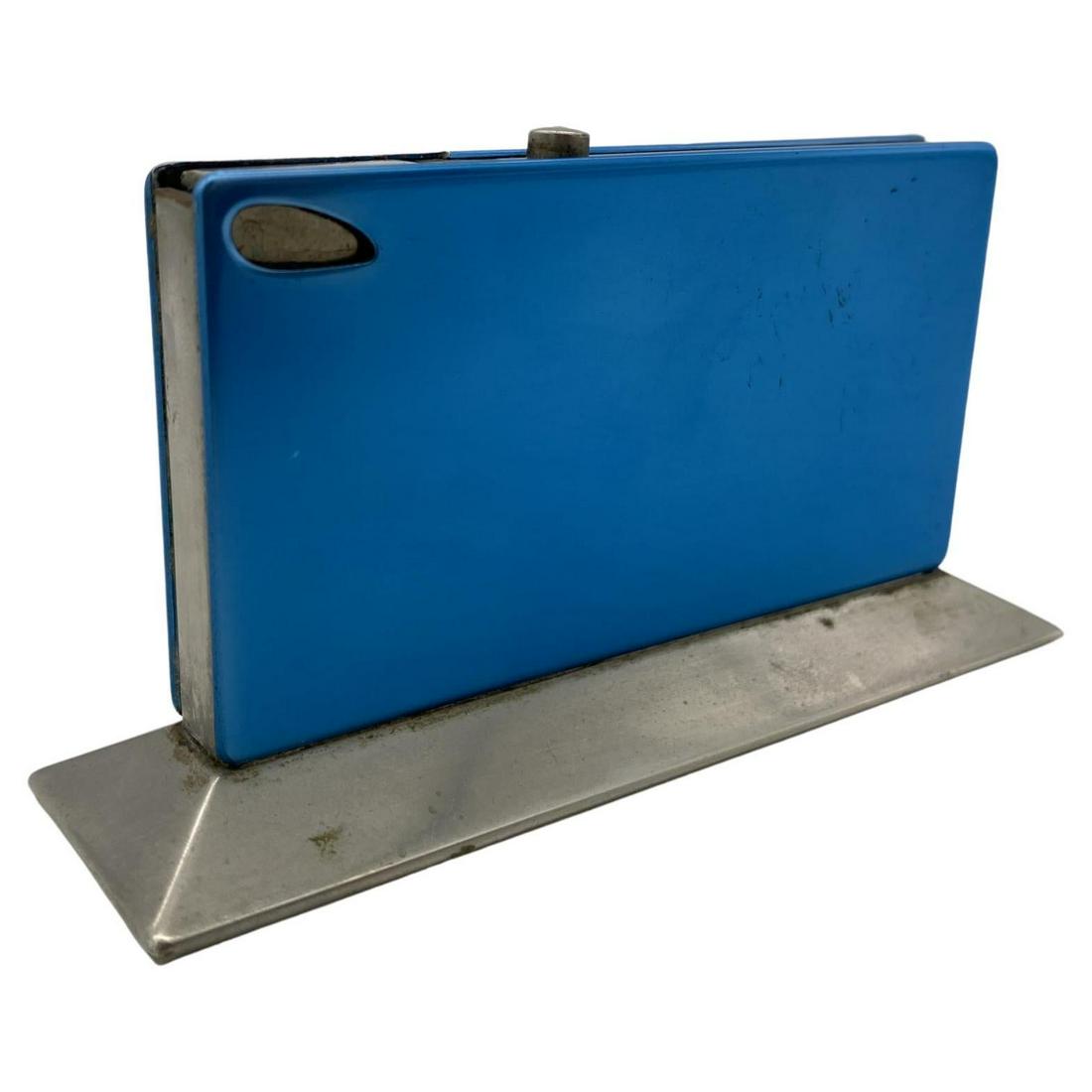 Blue Anodized Aluminum Table Lighter Circa 1960 Made in Germany: Blue Anodized Aluminum Table Lighter Circa 1960 Made in Germany Dimensions: Height: 2.5 in (6.35 cm)Width: 1.5 in (3.81 cm)Depth: 4.5 in (11.43 cm) Materials and Techniques: Aluminum Place of Origin: 