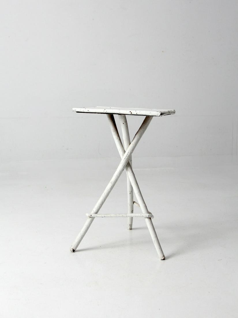 Antique White Twig Folk Art Table: Antique White Twig Folk Art Table This is an antique folk art twig table. The Adirondack style painted white table features rustic twig tripod legs with and wood top. Height 23 inch 58.4 cm Width 15.5