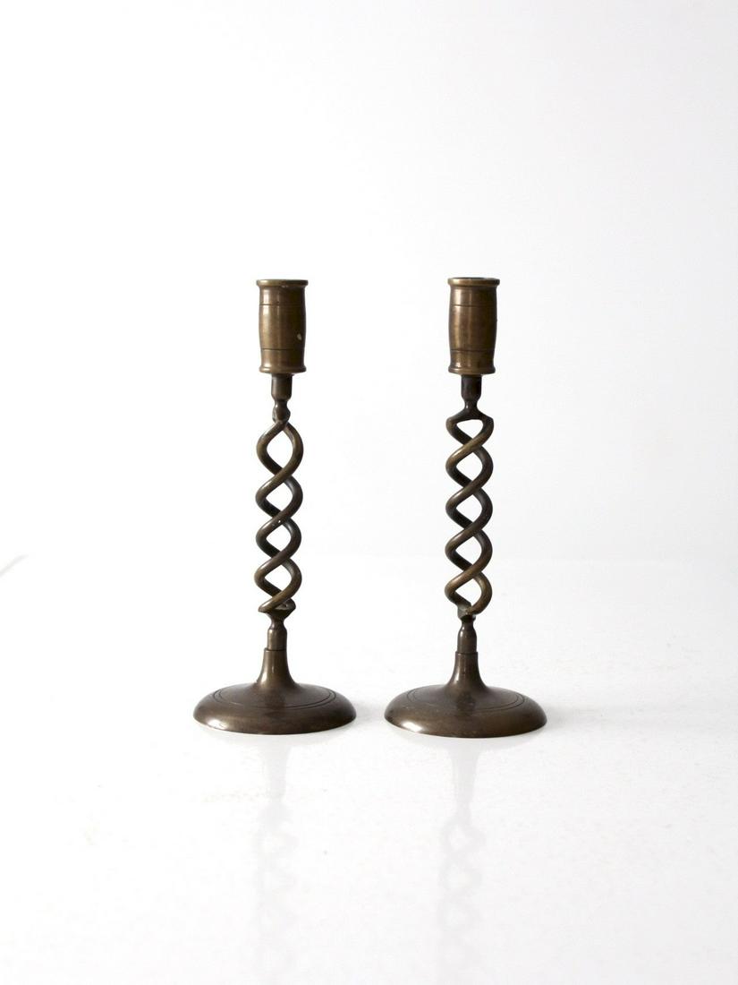 Vintage Brass Spiral Candlestick Holders: Vintage Brass Spiral Candlestick Holders This is a pair of vintage brass candlestick holders. The slender candle holders feature a spiral center column and round bases. Height 9.5 inch 24.1 cm Diamete