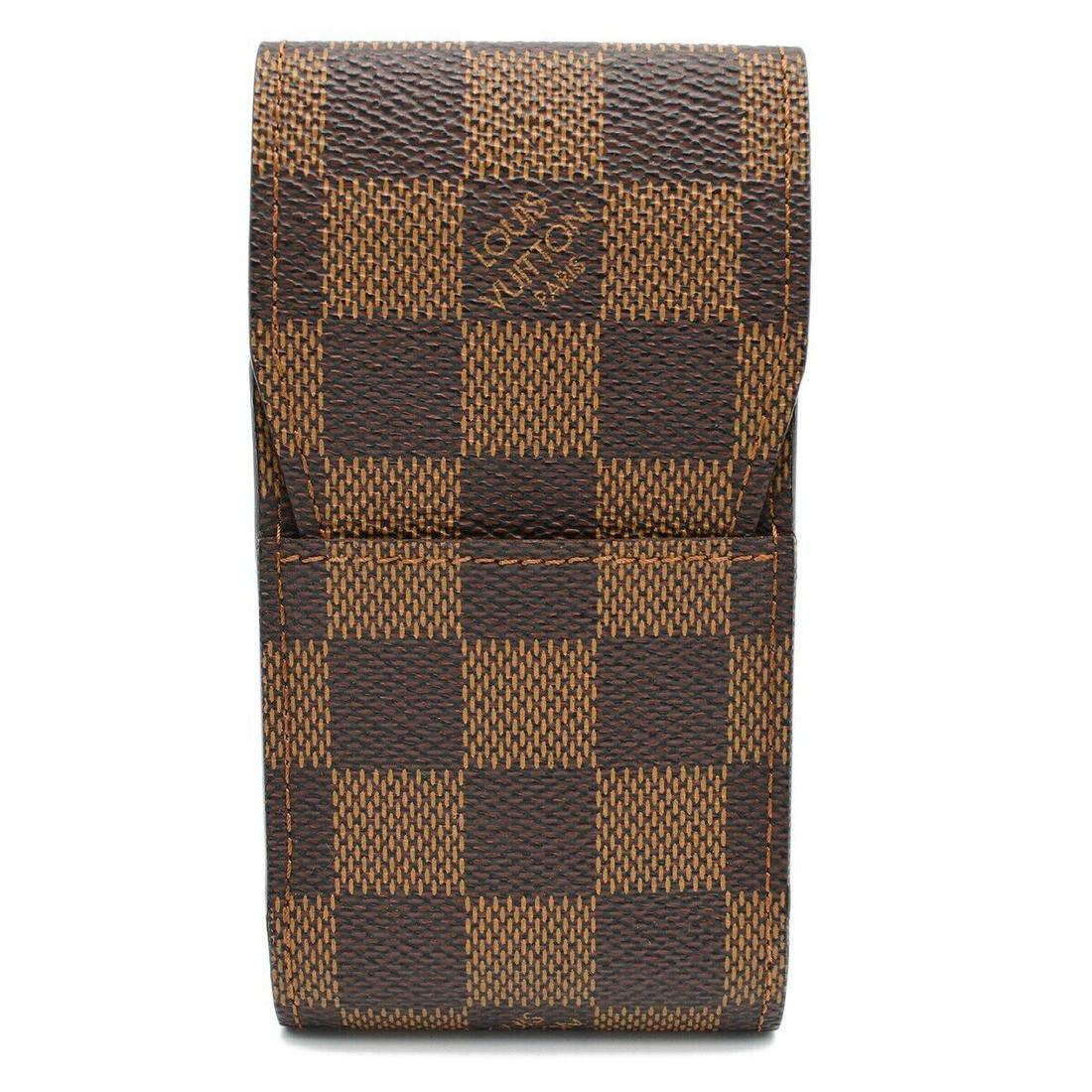 LOUIS VUITTON ETUI CIGARETTE CASE PURSE DAMIER EBENE N63024 CT1003: LOUIS VUITTON ETUI CIGARETTE CASE PURSE DAMIER EBENE N63024 CT1003 Outside Condition: A: Excellent/Inside Condition: A: Excellent The BIDHAUS Guarantee: All items in this auction are guaranteed to be 