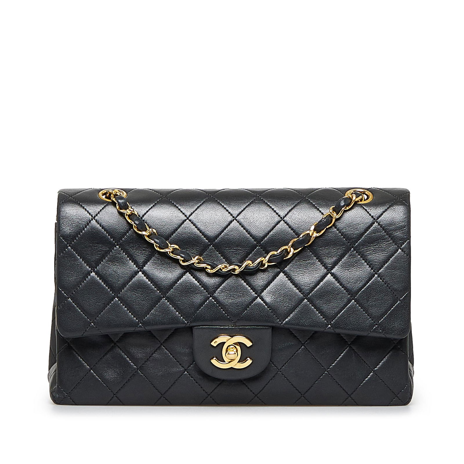 Chanel Medium Classic Lambskin Double Flap: Chanel Medium Classic Lambskin Double Flap This shoulder bag features a quilted lambskin body leather woven chain shoulder straps double front flaps with interlocking Cs and a twist lock closure an ex