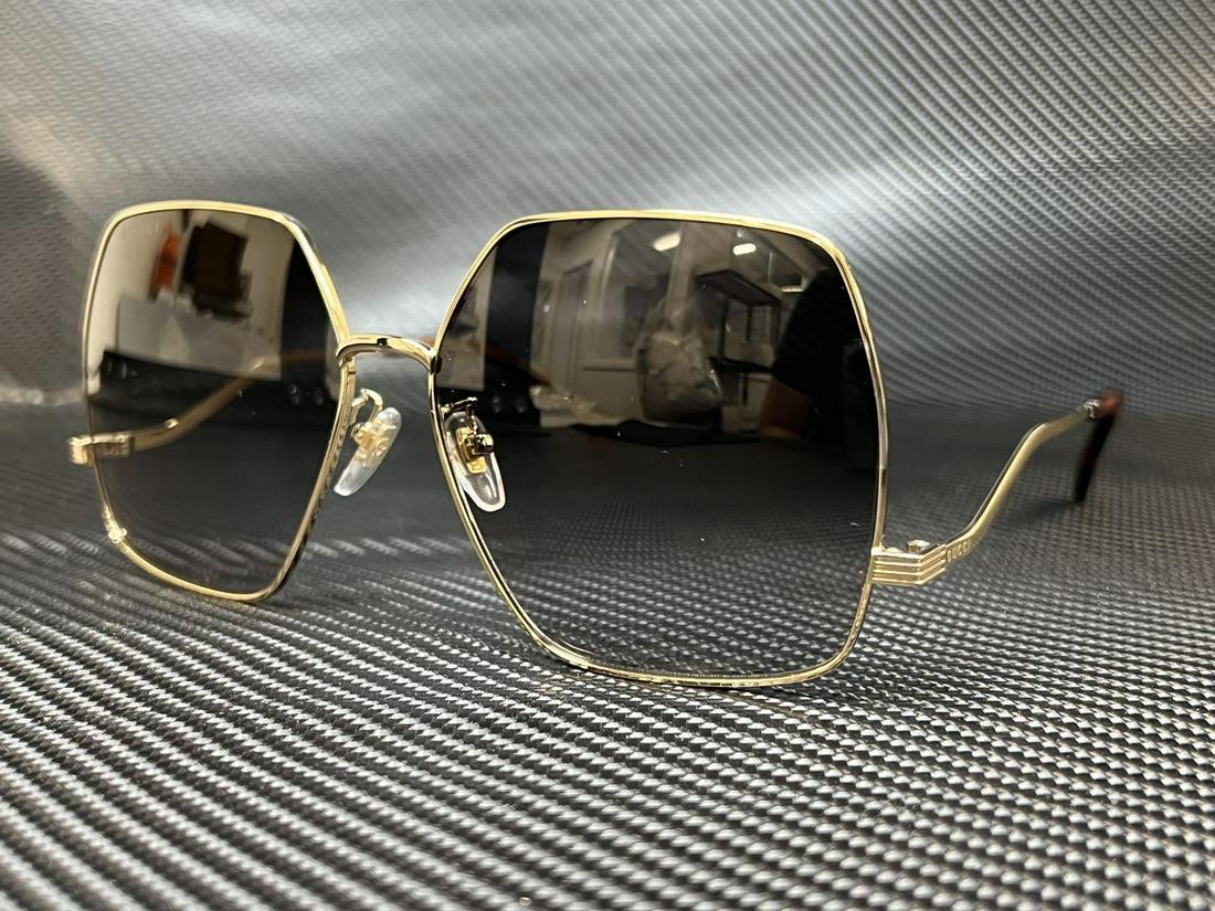 GUCCI GG1005S 002 Gold Hexagonal 61 mm Womens Sunglasses: GUCCI GG1005S 002 Gold Hexagonal 61 mm Womens Sunglasses Type: Sunglasses Frame Color: Gold New The BIDHAUS Guarantee: All items in this auction are guaranteed to be 100% authentic. At Your Service: A