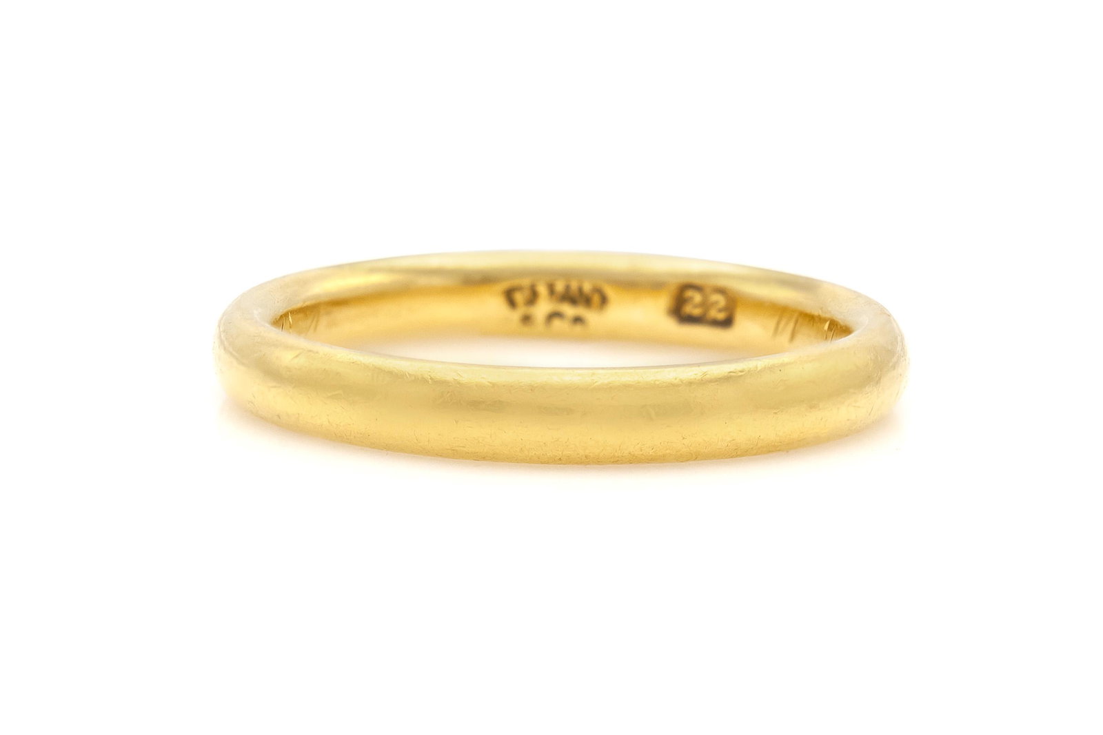 Tiffany & Co. 22K Gold Wedding Band: Tiffany & Co. 22K Gold Wedding Band Finely crafted in 22K yellow gold.Signed by Tiffany & Co.Size 5 1/42.5 mm wide The BIDHAUS Guarantee: All items in this auction are guaranteed to be 100% authentic.