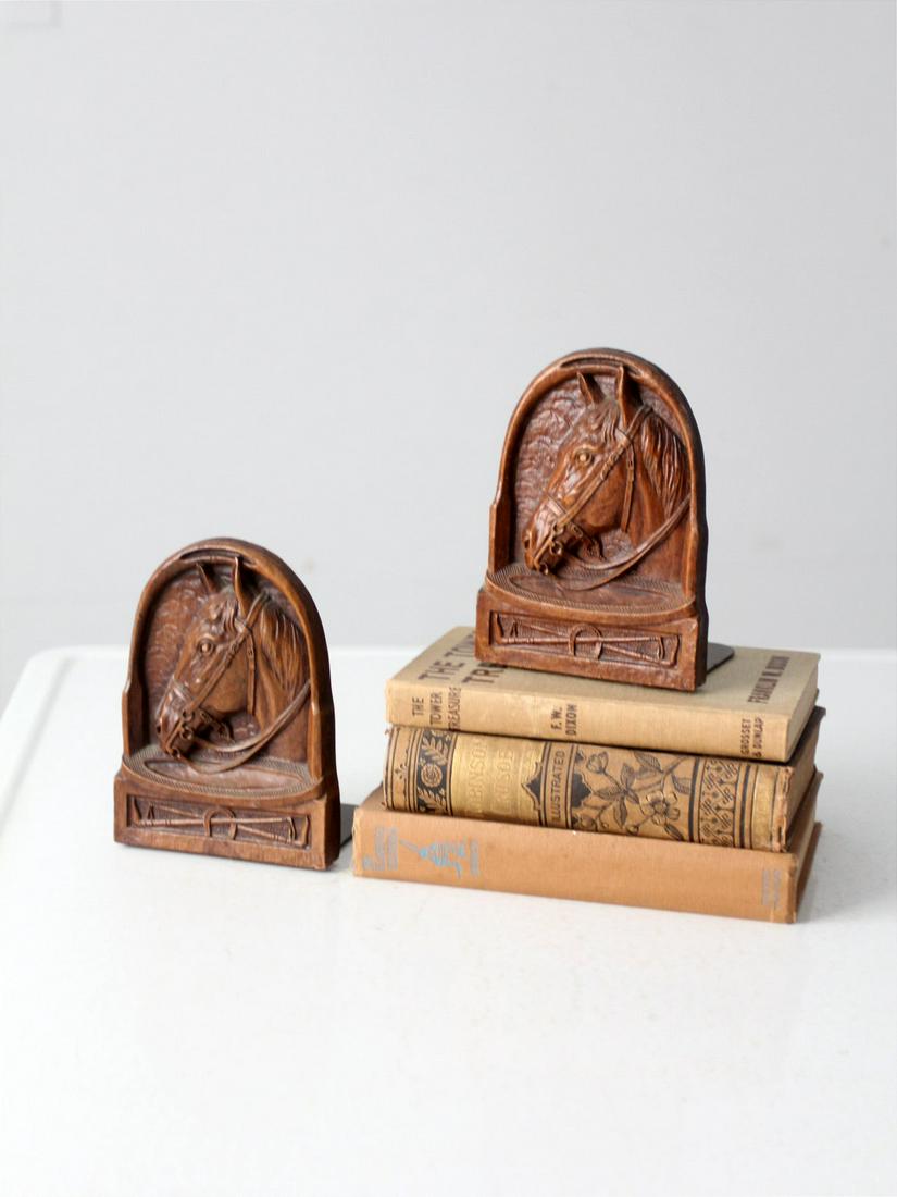 Vintage Syroco Style Equestrian Bookends: Vintage Syroco Style Equestrian Bookends This is a pair of vintage Syroco style bookends. Horses peer out across the pressed wood bookends showcasing an equestrian theme. They have metal bases with fe