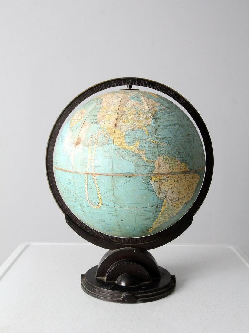 Replogle Globe Circa 1932: Replogle Globe Circa 1932 A Replogle world globe circa 1932. The 12 inch desk globe features a black art deco base and meridian. The tone of the globe is a beautiful pastel blue. Globe 12 inch 30.5 cm