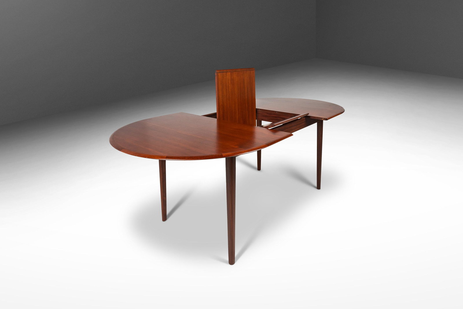 Danish Mid Century Modern Dining Table in Teak w/ Butterfly Leaf Denmark c. 1960s: Danish Mid Century Modern Dining Table in Teak w/ Butterfly Leaf Denmark c. 1960s Danish Mid Century Modern Dining Table in Teak w/ Butterfly Leaf Denmark c. 1960's About: This remarkable extension di