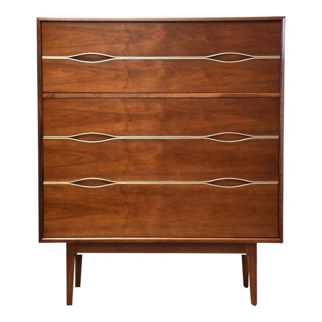 Walnut and Brass Tall Dresser: Walnut and Brass Tall Dresser A mid century modern walnut tall dresser with brass details. Professionally refinished. 37.5" wide. 19" deep. 44" tall. Dimensions: 37.5"W x 19"D x 44"H Styles: Mid-Centu