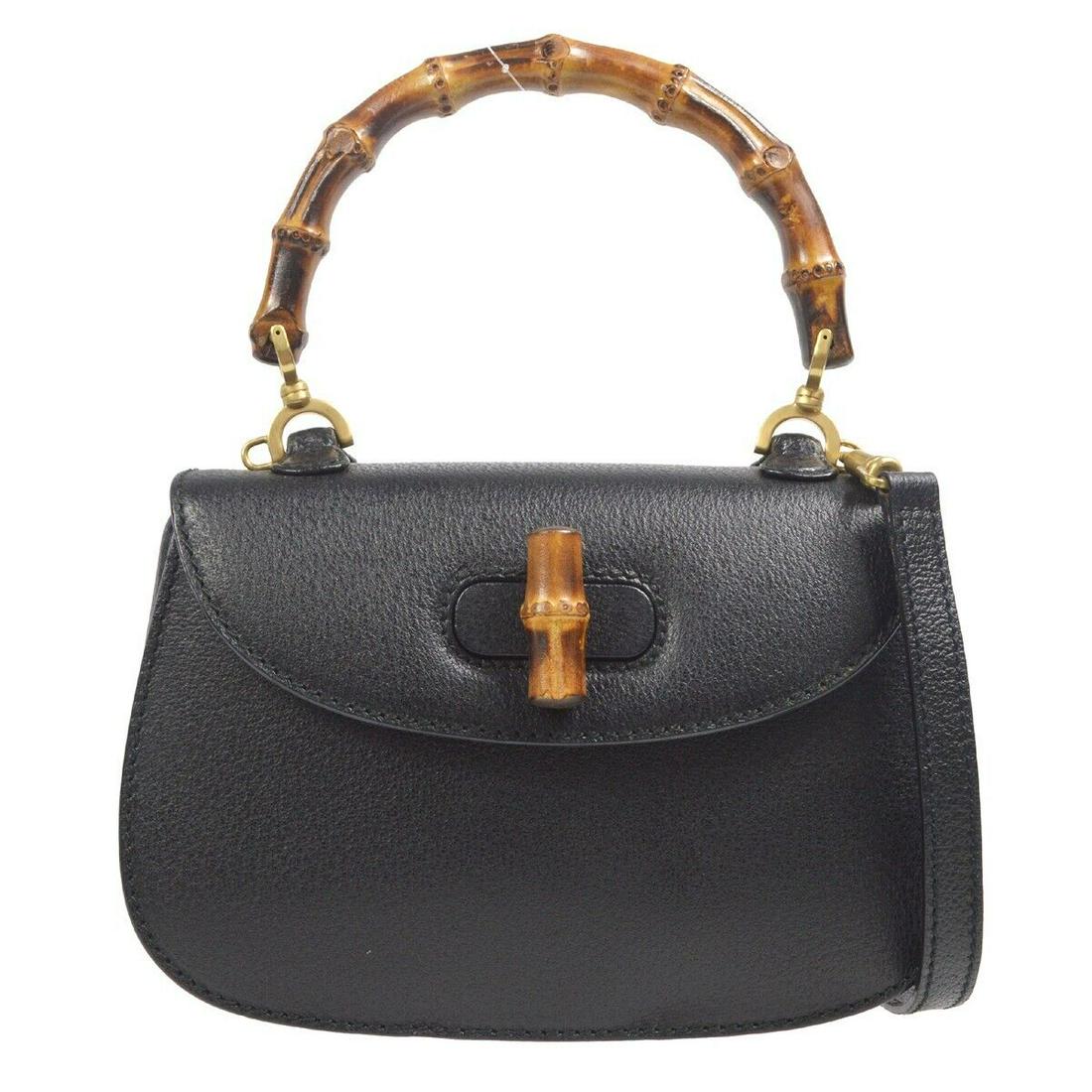 Gucci Bamboo 2way Handbag Purse Black Leather 000 2046 0188: Gucci Bamboo 2way Handbag Purse Black Leather 000 2046 0188 Bag Width: 9 in Bag Height: 6 in Closure: Turn Lock Size: Small Handle Style: Top Handle Handle Drop: 4 in Bag Depth: 3 in Exterior Material