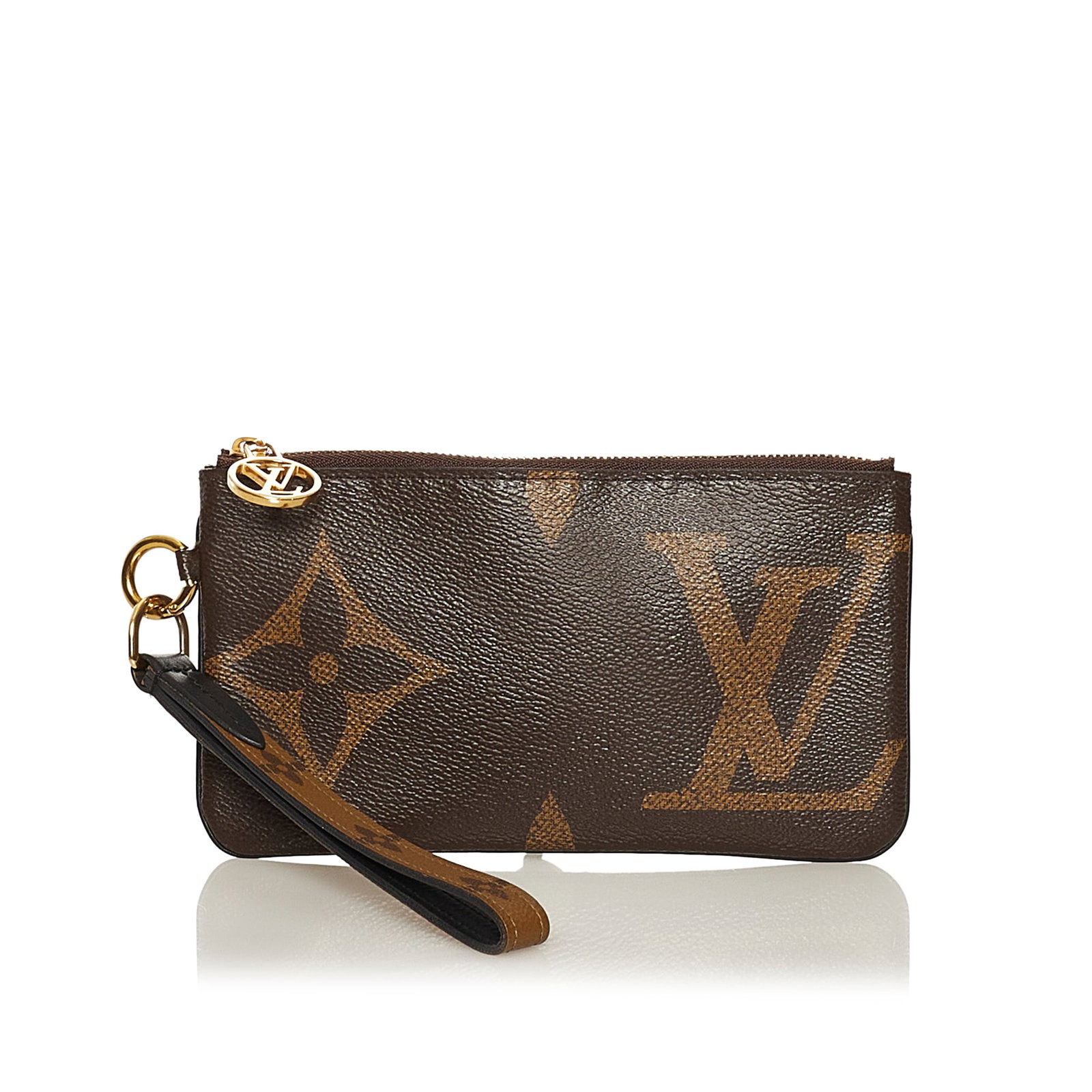 Louis Vuitton Monogram Reverse Giant Trio Pouch: Louis Vuitton Monogram Reverse Giant Trio Pouch The Trio Pouch features the monogram canvas body a monogram canvas wristlet and top zip closures. Brand: Louis Vuitton Model: Monogram Reverse Giant Tri