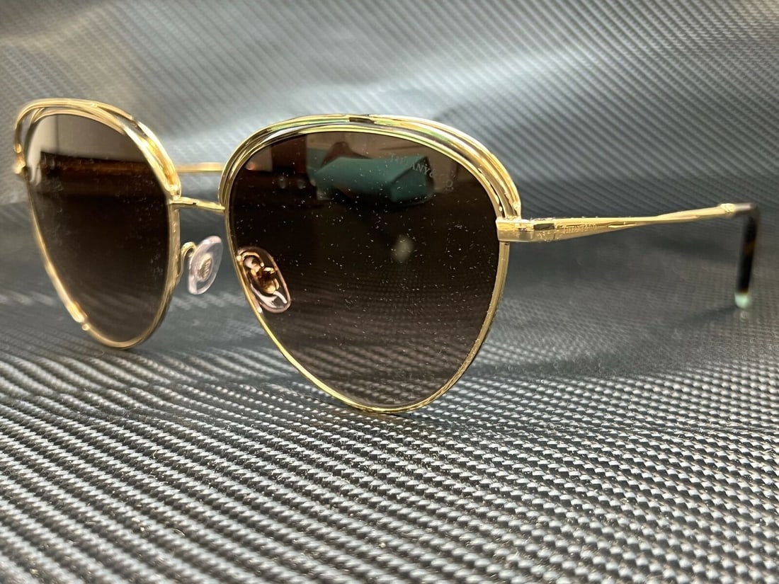 TIFFANY TF3075 60213B Pale Gold Round Womens 58 mm Sunglasses: TIFFANY TF3075 60213B Pale Gold Round Womens 58 mm Sunglasses Type: Sunglasses Frame Color: Gold Style: Round New The BIDHAUS Guarantee: All items in this auction are guaranteed to be 100% authentic. 