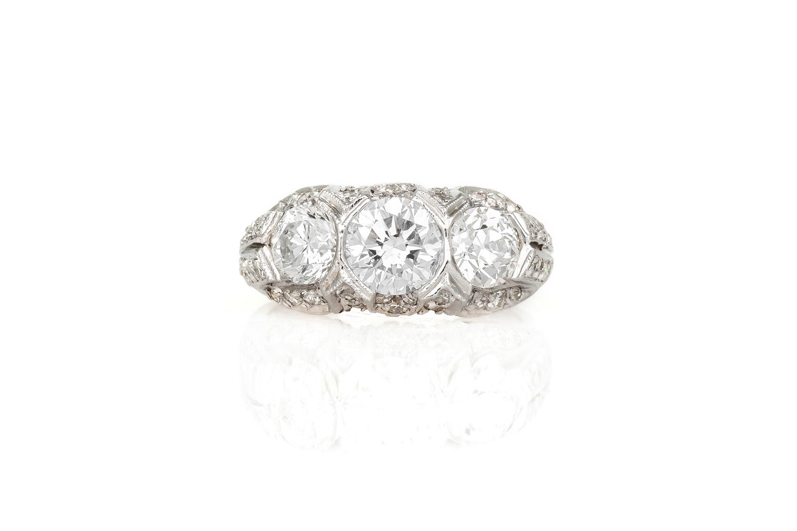 Three Stone Edwardian Ring: Three Stone Edwardian Ring Antique Edwardian ring finely crafted in platinum with three Old European cut diamonds; center diamond weighing 1.01 carat flanked by two diamonds weighing a total of 1.13 c