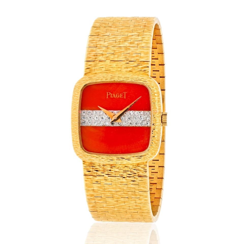 Piaget 18K Yellow Gold 1970's Coral Diamond Dial Vintage 9902A6 Watch: Piaget 18K Yellow Gold 1970's Coral Diamond Dial Vintage 9902A6 Watch Type: Vintage Watches Metal: 18K Yellow Gold Grams: 64.5 Measurements: Wrist Circumference: 6 inches Condition: Excellent. Signed