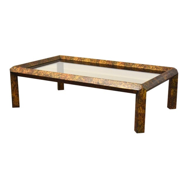 1970s Phyllis Morris Faux Copper Coffee Table: 1970s Phyllis Morris Faux Copper Coffee Table A mid century modern faux copper parsons style coffee table with a smoked glass insert top by Phyllis Morris 60" wide. 36.5" deep. 17.5" tall. Dimensions: