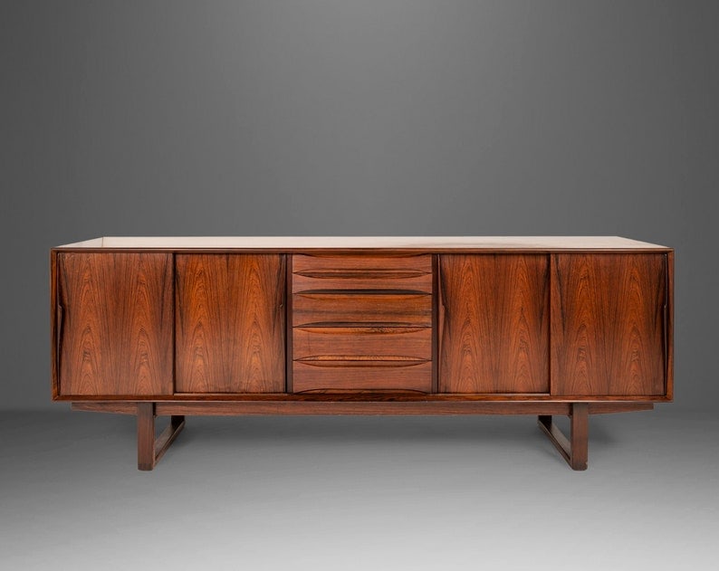 Danish Modern Rosewood Credenza Set On A Sled Base Attributed To Arne Vodder Denmark 1960S: Danish Modern Rosewood Credenza Set On A Sled Base Attributed To Arne Vodder Denmark 1960S Danish Modern Rosewood Credenza Set on a Sled Base Attributed to Arne Vodder Denmark 1960s About: Equal parts
