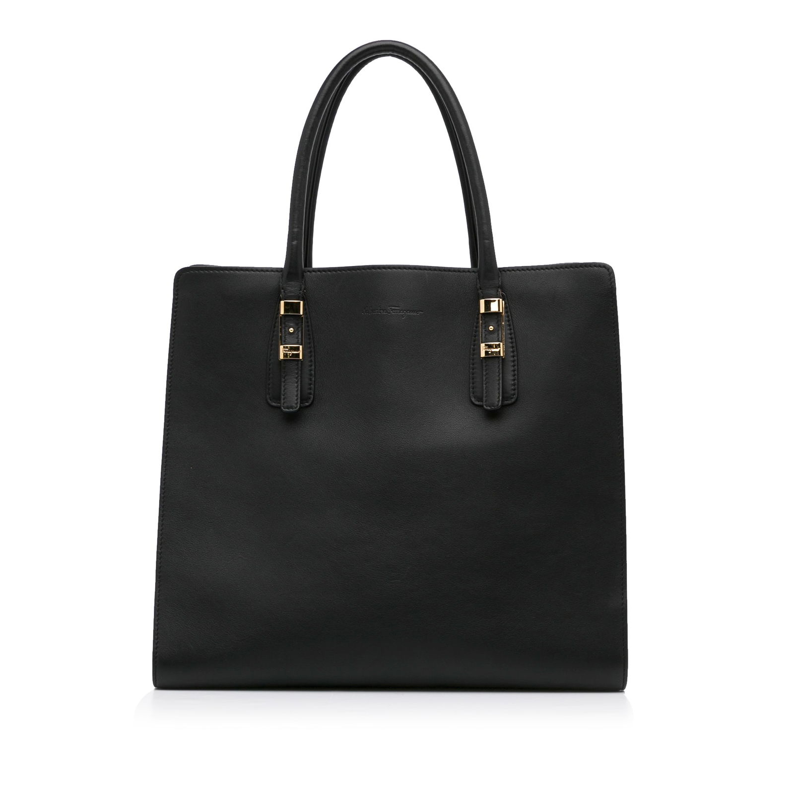 Ferragamo Leather Tote: Ferragamo Leather Tote This tote bag features a leather body rolled handles an open top with magnetic button closure and an interior zip compartment. Brand: Ferragamo Model: Leather Tote Origin: Italy
