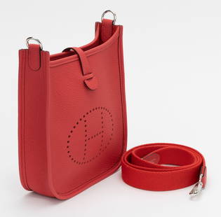 Hermes Mini Evelyne Crossbody Capucine BNIB: Hermes Mini Evelyne Crossbody Capucine BNIB Brand: Hermes Dimensions: Height: 7 in (17.78 cm)Width: 2 in (5.08 cm)Length: 6.75 in (17.15 cm) Place of Origin: France Period: 21st Century Pre-Owned The