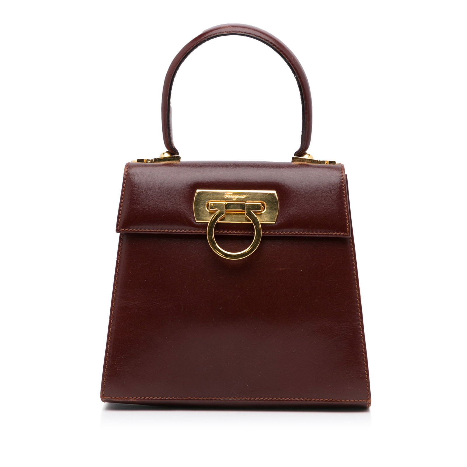 Ferragamo Gancini Satchel: Ferragamo Gancini Satchel The Gancini satchel features a leather body a flat leather top handle detachable flat strap a front flap with a magnetic closure and an interior zip pocket. Brand: Ferragamo