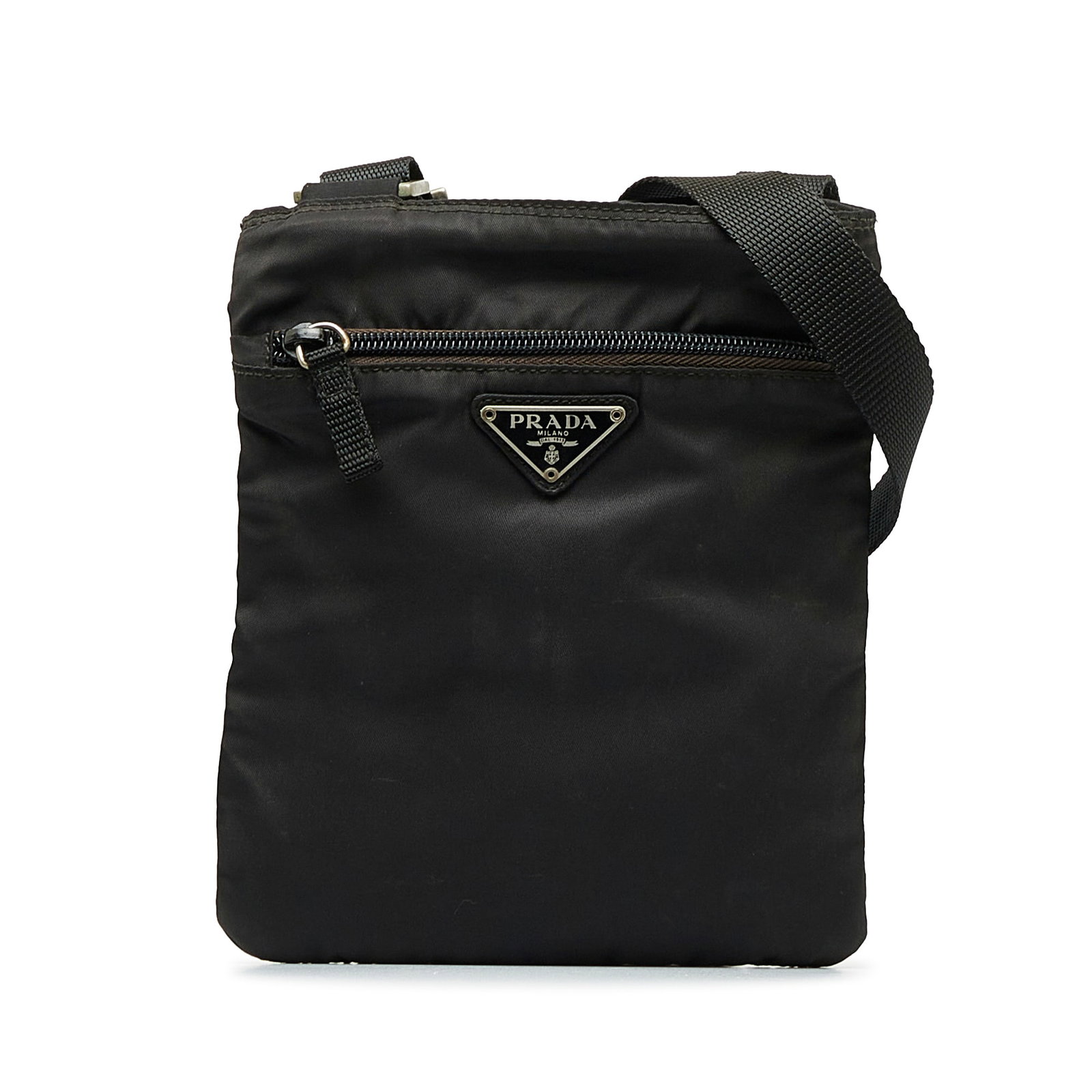 Prada Tessuto Crossbody Bag: Prada Tessuto Crossbody Bag This crossbody bag features a nylon body an adjustable flat strap a top zip closure an exterior front zip pocket and an interior zip pocket. Brand: Prada Model: Tessuto Cro