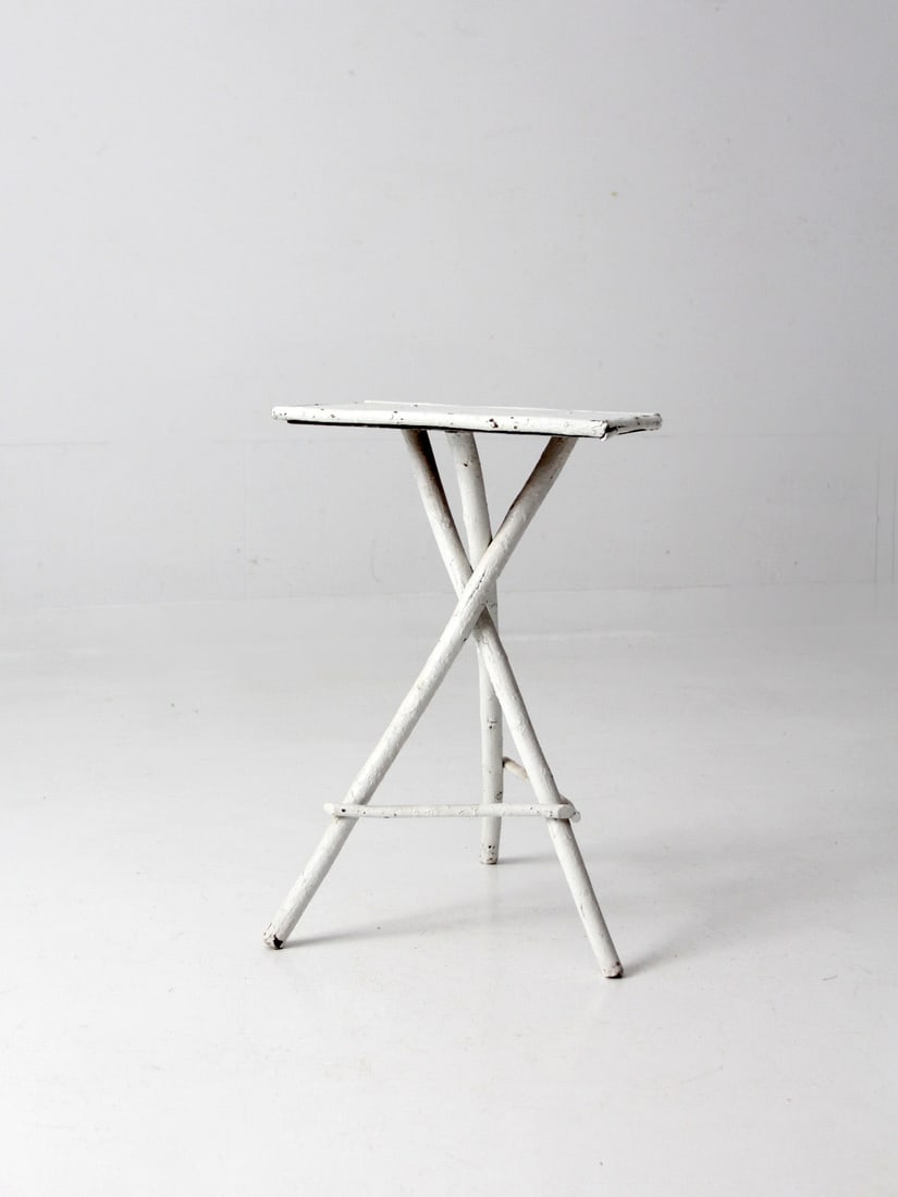 Antique White Twig Folk Art Table: Antique White Twig Folk Art Table This is an antique folk art twig table. The Adirondack style painted white table features rustic twig tripod legs with and wood top. Height 23 inch 58.4 cm Width 15.5