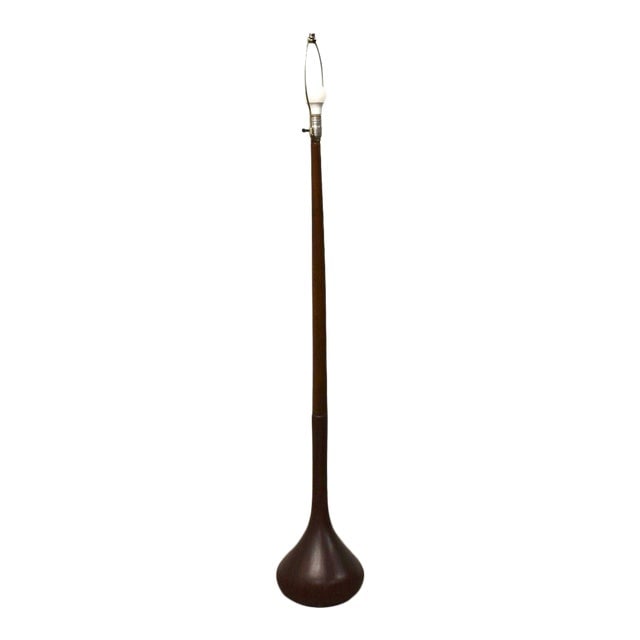 Danish Modern Teak Floor Lamp: Danish Modern Teak Floor Lamp A mid century modern teak floor lamp with a Hershey kiss shaped base. 8.75" diameter. 59" tall to the top of the harp. Dimensions: 8.75"W x 8.75"D x 59"L Styles: Danish M
