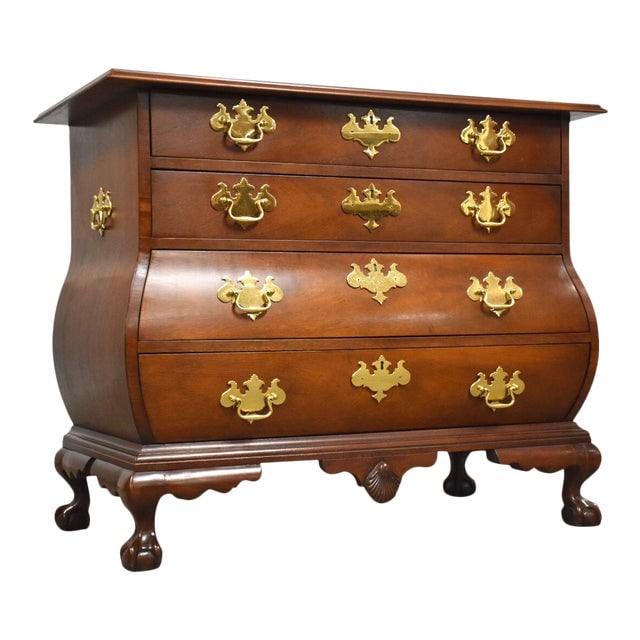 1980s Mahogany and Brass Baker Dresser Chest: 1980s Mahogany and Brass Baker Dresser Chest A high quality solid mahogany bombe and chippendale style four drawer ball and claw dresser chest with brass hardware by Baker Furniture. 39" wide. 20.5" d