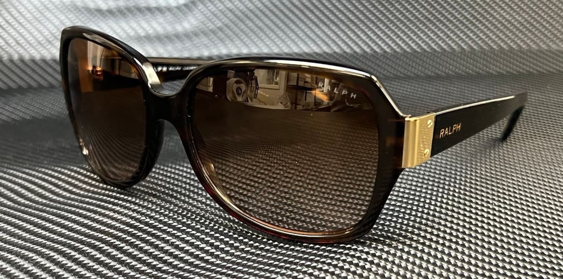 RALPH RA5138 510 13 Dark Havana Grad Brown 58 mm Womens Sunglasses: RALPH RA5138 510 13 Dark Havana Grad Brown 58 mm Womens Sunglasses Frame Color: Brown Type: Sunglasses New The BIDHAUS Guarantee: All items in this auction are guaranteed to be 100% authentic. At Your