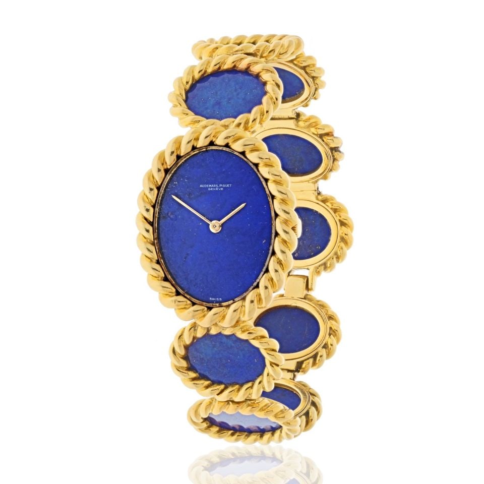 Audemars Piguet 18K Yellow Gold 1960's Blue Lapis Oval Link Wrist Watch: Audemars Piguet 18K Yellow Gold 1960's Blue Lapis Oval Link Wrist Watch Type: Vintage Watches Metal: 18K Yellow Gold Grams: 86.7 Measurements: L: 7.5 inches Condition: Excellent. Signed By: Audemars P