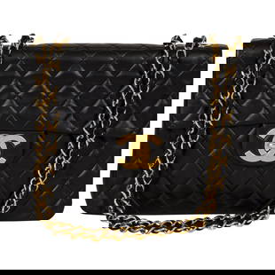 Chanel Black Lambskin Maxi Flap Bag: Chanel Black Lambskin Maxi Flap Bag Designer: Chanel Brand: Chanel Dimensions: Height: 9 in (22.86 cm)Width: 4 in (10.16 cm)Length: 13 in (33.02 cm) Place of Origin: France Period: 21st Century Pre-Ow