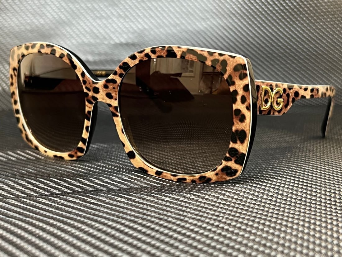 DOLCE & GABBANA DG4385 316313 Leo Brown on Black Square 58 mm Womens Sunglasses: DOLCE & GABBANA DG4385 316313 Leo Brown on Black Square 58 mm Womens Sunglasses Frame Color: Black Style: Square Type: Sunglasses New The BIDHAUS Guarantee: All items in this auction are guaranteed to