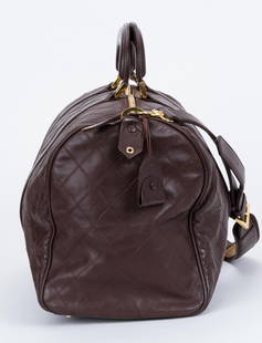Chanel Vintage Brown Diamond Quilted Duffle Bag 1980s: Chanel Vintage Brown Diamond Quilted Duffle Bag 1980s Designer: Chanel Brand: Chanel Dimensions: Height: 11 in (27.94 cm)Width: 9 in (22.86 cm)Length: 19 in (48.26 cm) Place of Origin: France Period:
