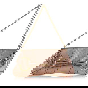 Gucci X Tom Ford Vintage Horsebit Baguette: Gucci X Tom Ford Vintage Horsebit Baguette This baguette features a leather body gold-toned chain strap a front flap and an interior slip pocket. Brand: Gucci Model: X Tom Ford Vintage Horsebit Baguet