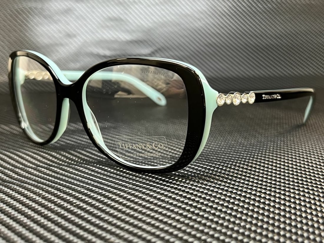 TIFFANY TF4121B 80551W Black Clear 100% UVA/UVB Womens Sunglasses 55 mm: TIFFANY TF4121B 80551W Black Clear 100% UVA/UVB Womens Sunglasses 55 mm Frame Color: Black Type: Sunglasses New The BIDHAUS Guarantee: All items in this auction are guaranteed to be 100% authentic. At