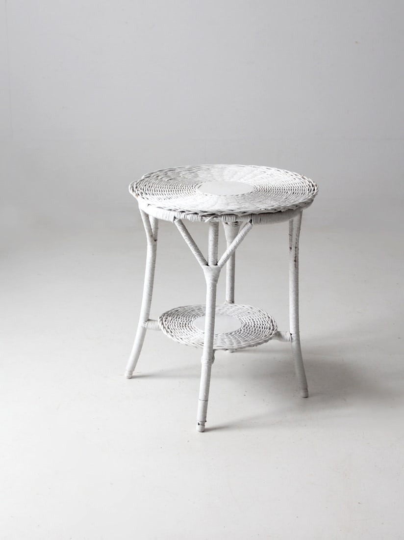 Antique White Wicker Table: Antique White Wicker Table This is an early 20th century antique wicker side table. The white woven table features a round table top with splay legs and a stretcher shelf. Height 26.5 inch 67.3 cm Dia