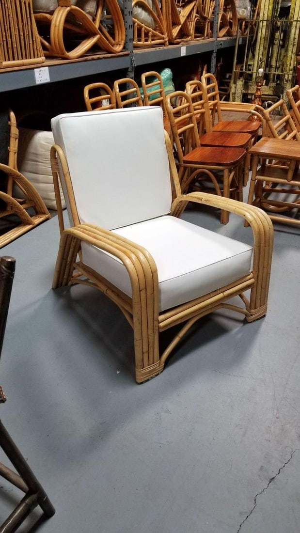 Restored 4-Strand Staple Arm Rattan Lounge Chair by Paul Laszlo: Restored 4-Strand Staple Arm Rattan Lounge Chair by Paul Laszlo Dimensions: Height: 31 in (78.74 cm)Width: 30 in (76.2 cm)Depth: 37 in (93.98 cm) Materials and Techniques: Rattan Period: 1950-1959 Dat